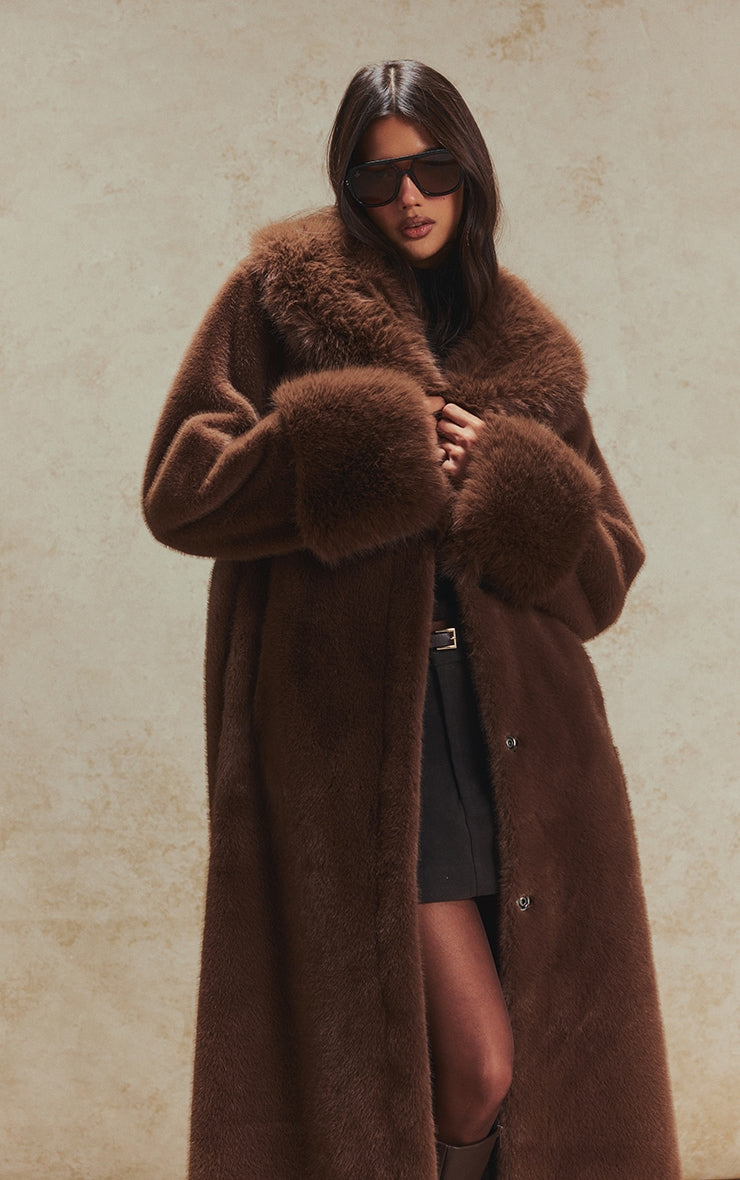 https://cdn-img.prettylittlething.com/6/b/d/0/6bd0735b6ade9c60c3d329e0f7ce36b261837c1f_CNN8393_3_chocolate_faux_fur_self_tie_oversized_coat.jpg